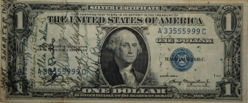 old one dollar bill with writing on it