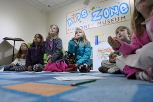 group of kids at the money museum kidz zone