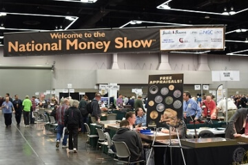 welcome the national money show banner with a wide shot of the show