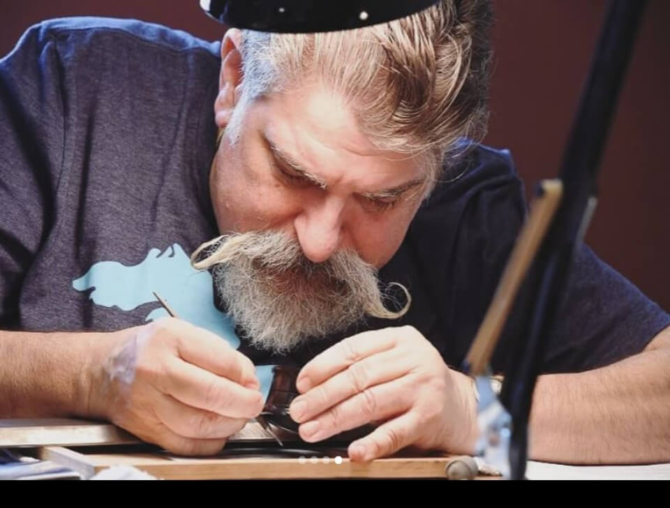 man studying coin